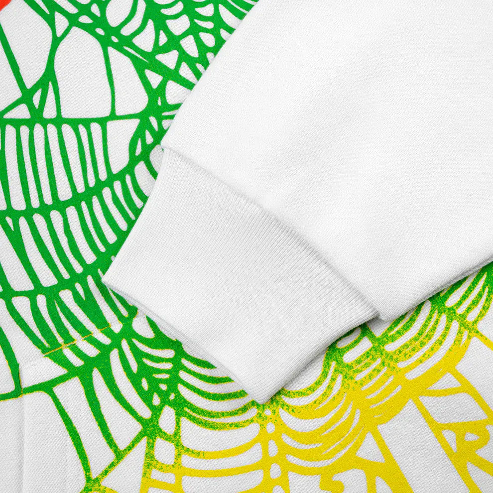 Close-up of the Sp5der “Toxic Web” Hoodie – White & Neon Lime, a 440GSM heavyweight oversized pullover, highlighting its sleeve’s bold green and yellow abstract web patterns for an iconic Y2K streetwear vibe.
