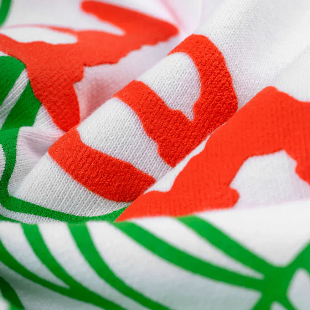 Close-up of white 440GSM heavyweight fleece with neon lime designs, highlighting its textured surface—ideal for a Y2K streetwear look with the Sp5der “Toxic Web” Hoodie – White & Neon Lime Oversized Pullover.