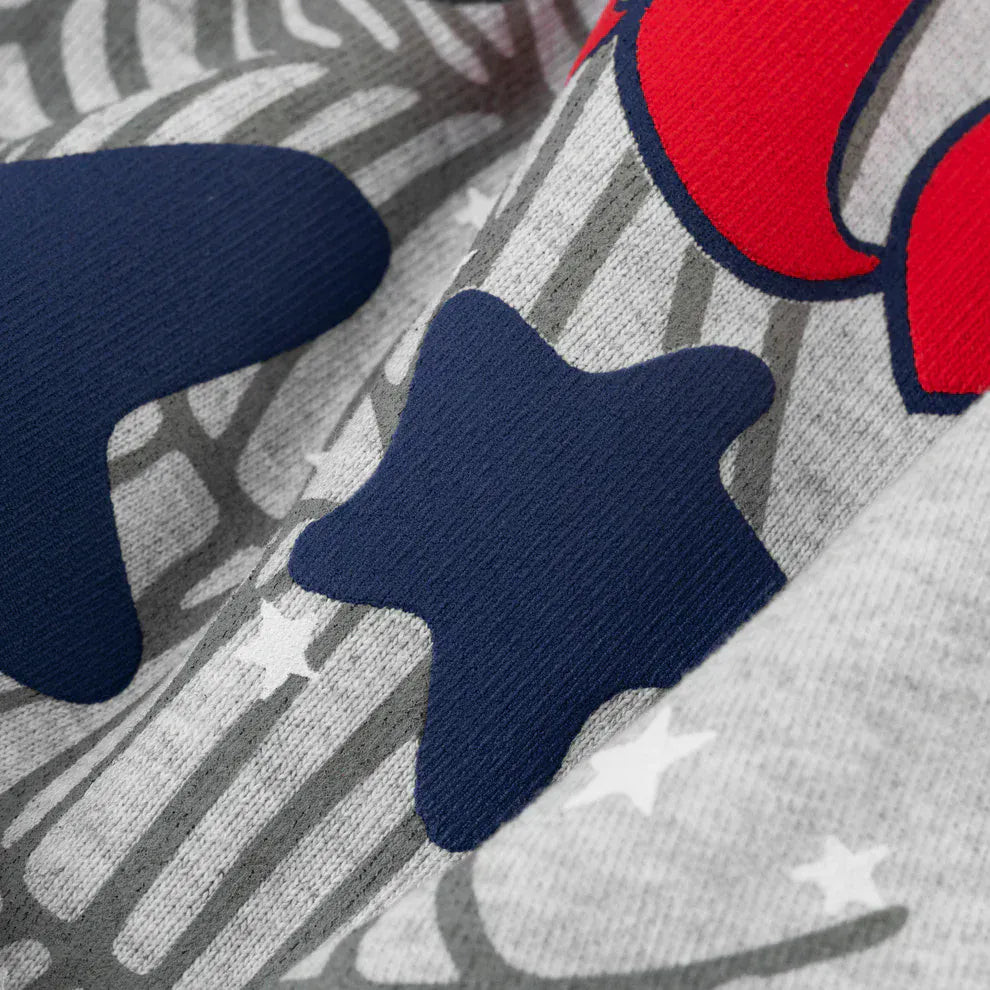 Close-up of the Sp5der Atlanta Web Zip Hoodie in grey 440GSM heavyweight fabric, showcasing blue and red printed shapes with star patterns and a textured, overlapping streetwear design.