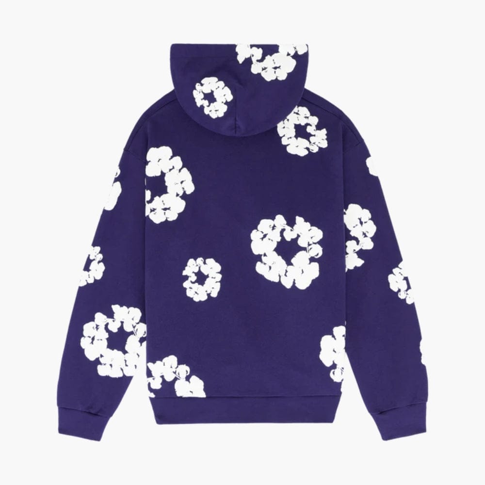 The Purple “Cotton Wreath” Denim Tears Hoodie is a streetwear pullover with a hood and white floral print on the back and sleeves.