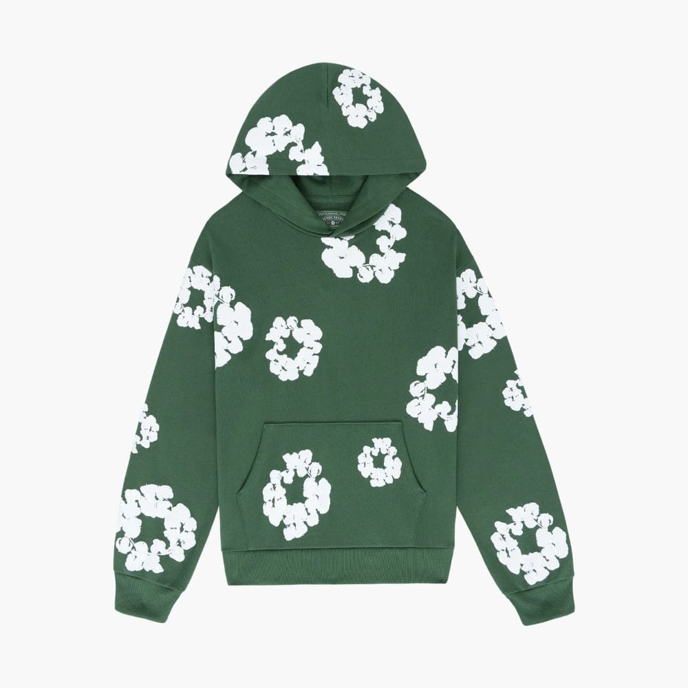 The Forest Green “Cotton Wreath” Denim Tears Hoodie is a streetwear pullover featuring bold white floral prints and a front pocket, inspired by the signature Cotton Wreath motif for a standout look.