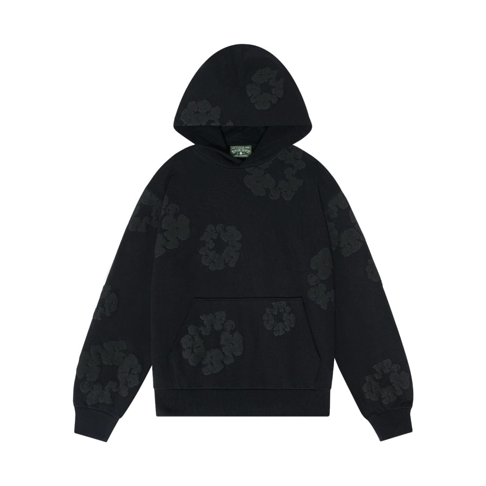 The Black Monochrome “Cotton Wreath” Denim Tears Hoodie is a minimal streetwear sweatshirt featuring subtle wreath motifs, a cozy hood, front kangaroo pocket, and sleek black design inspired by iconic Denim Tears style.