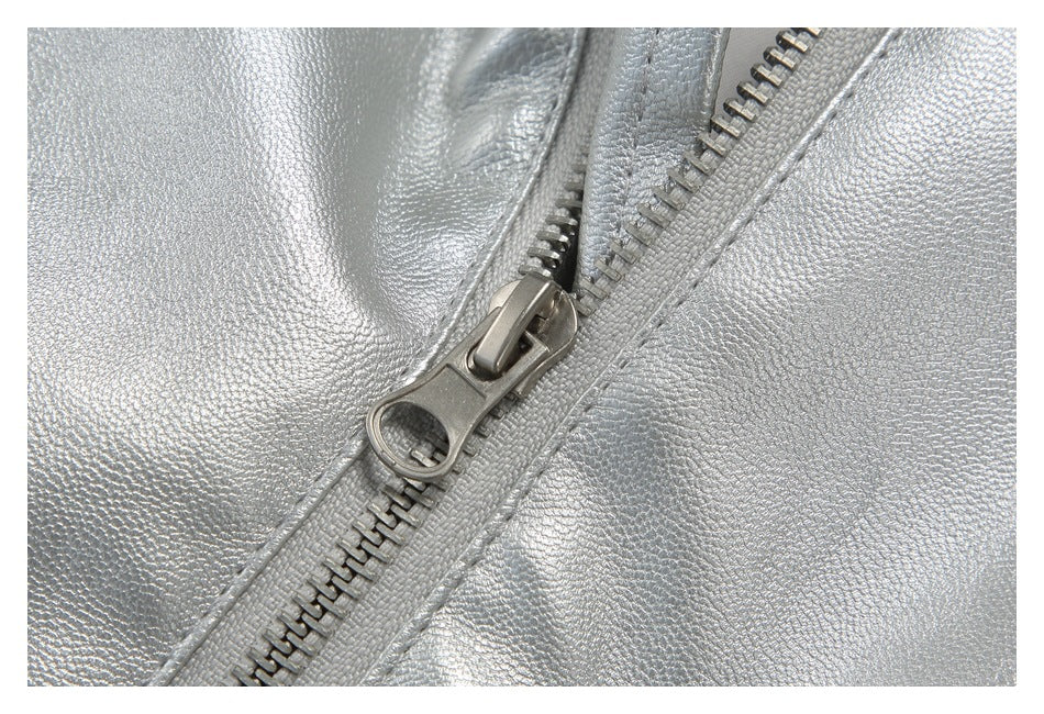 Close-up of the silver jacket's metal zipper and textured finish.