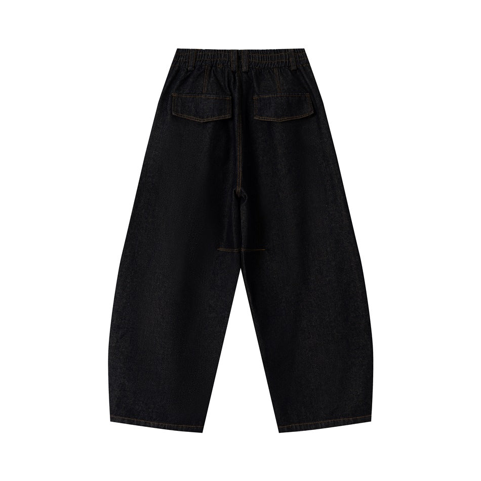 Back view of dark wide-leg jeans with an elasticized waist, two patch pockets, and contrast stitching.