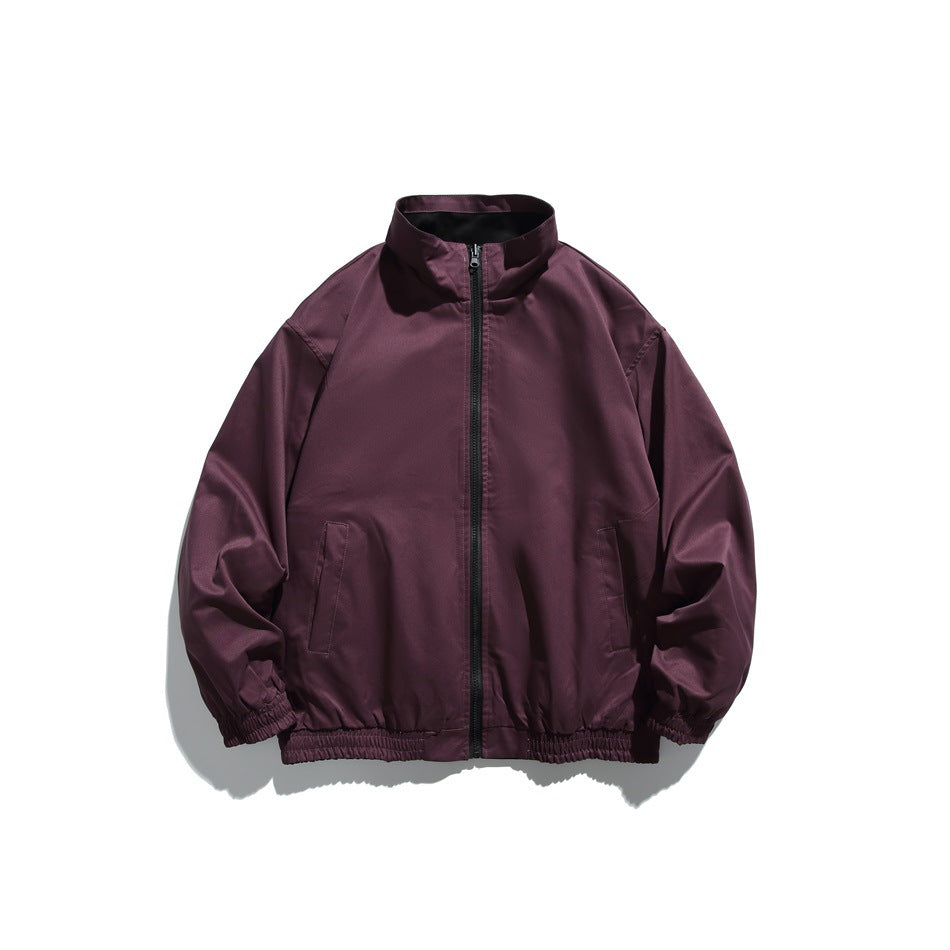 Plum zip-front jacket with a stand collar, two slanted hand pockets, and elastic cuffs and hem.