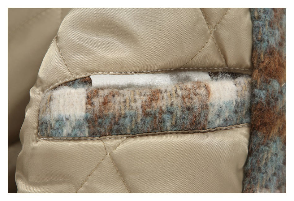 Close-up of beige quilted lining with a rectangular strip of fuzzy plaid fabric.