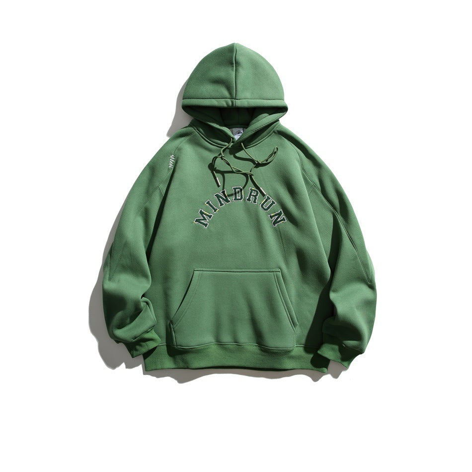Green pullover hoodie flat lay with dark arched MINDRUN lettering, drawstrings and front pouch pocket