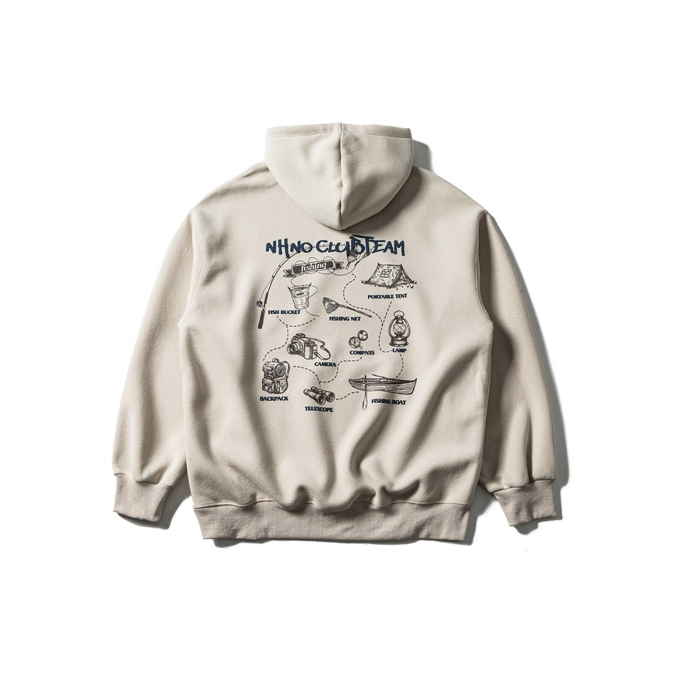 Back of a light apricot hooded sweatshirt with a navy camping and fishing illustrated print