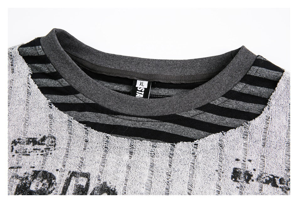 Close-up of the layered shirt's gray ribbed neckline, striped inner collar, and textured vertical stripe fabric.