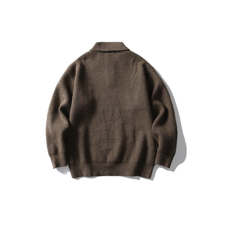 Back view of a brown long-sleeve rib-knit polo sweater laid flat.