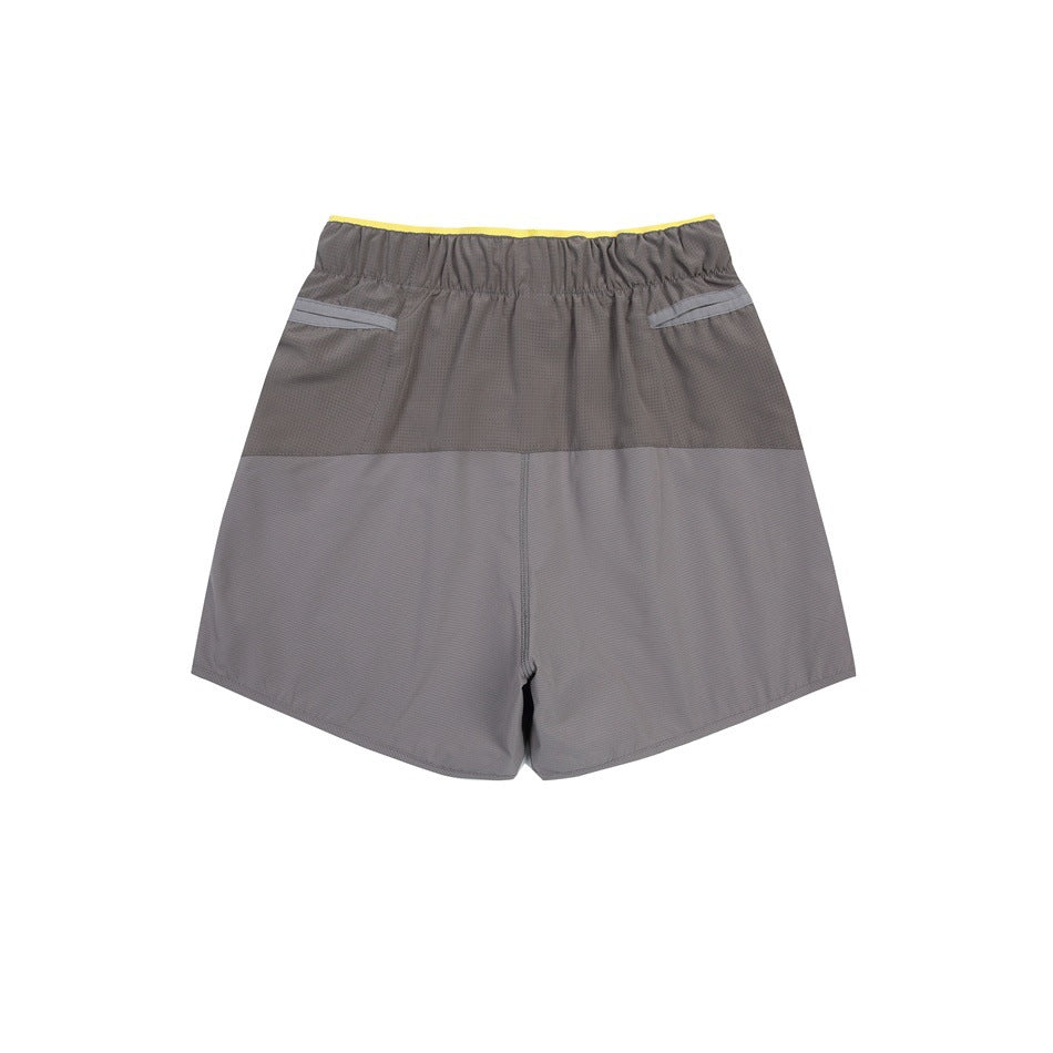 Back view of gray two-tone shorts with an elastic waist and two rear pockets.