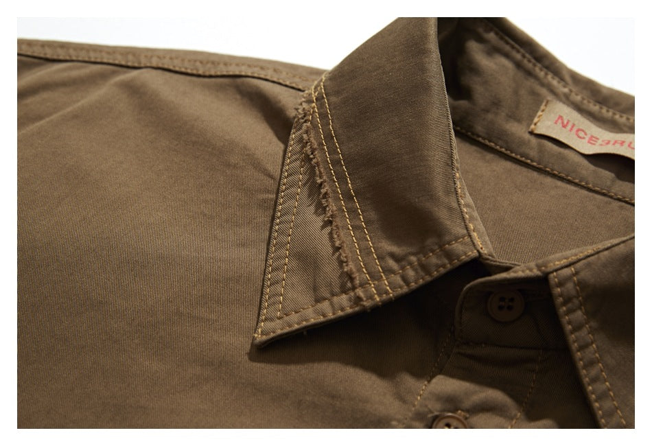 Close-up of the brown shirt's collar seam, double stitching, and a partial sewn-in neck label.