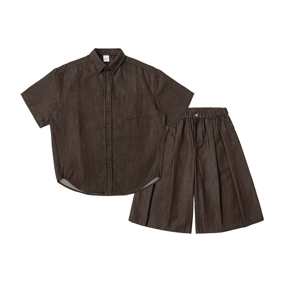 Flat lay of a dark brown short-sleeve button-up shirt with a chest pocket and matching wide-leg shorts.