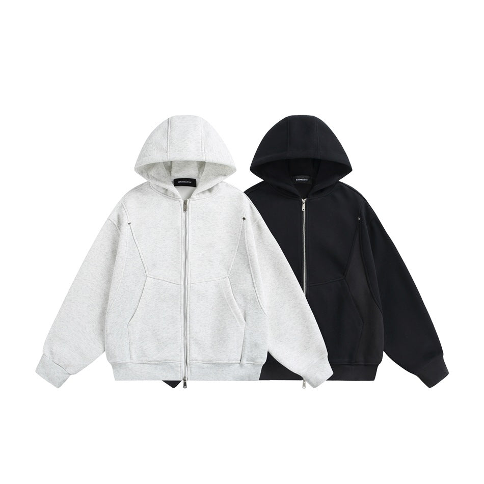 Front views of two zip-up hoodies with front pockets, one light gray heather and one black.