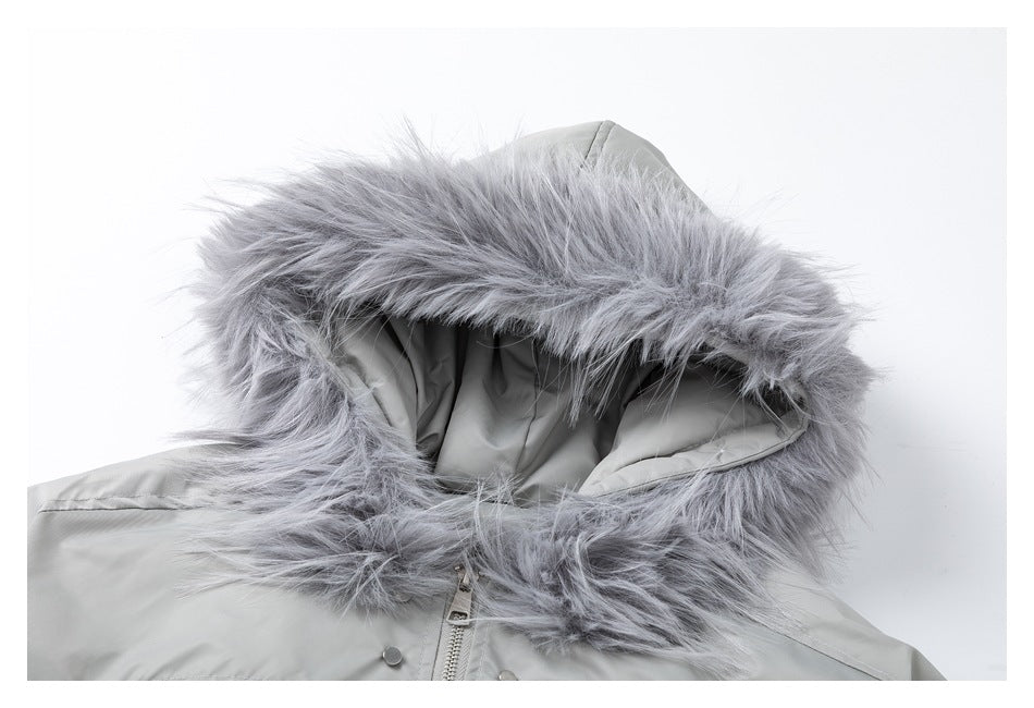 Close-up of a light gray jacket hood with thick gray faux-fur trim and visible front zipper.