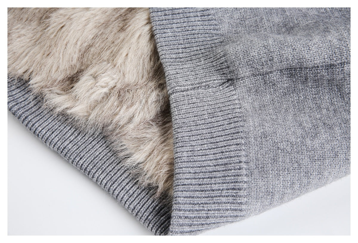 Close-up showing beige faux-fur lining inside the gray knit jacket's ribbed hem.