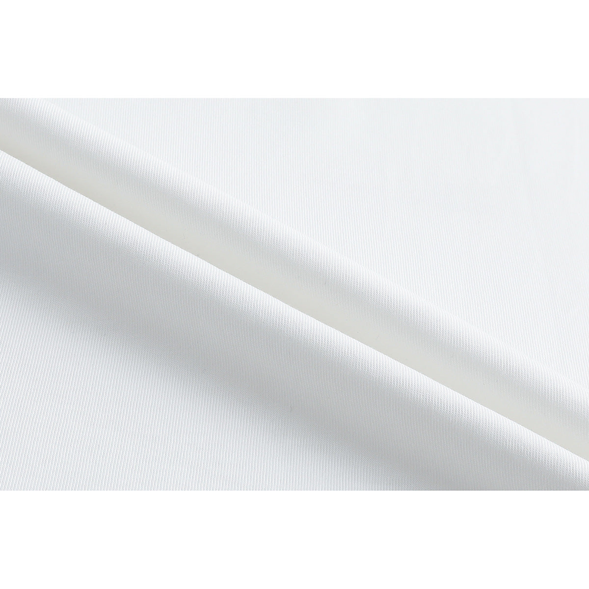 Close-up showing the fine surface texture of white T-shirt fabric.