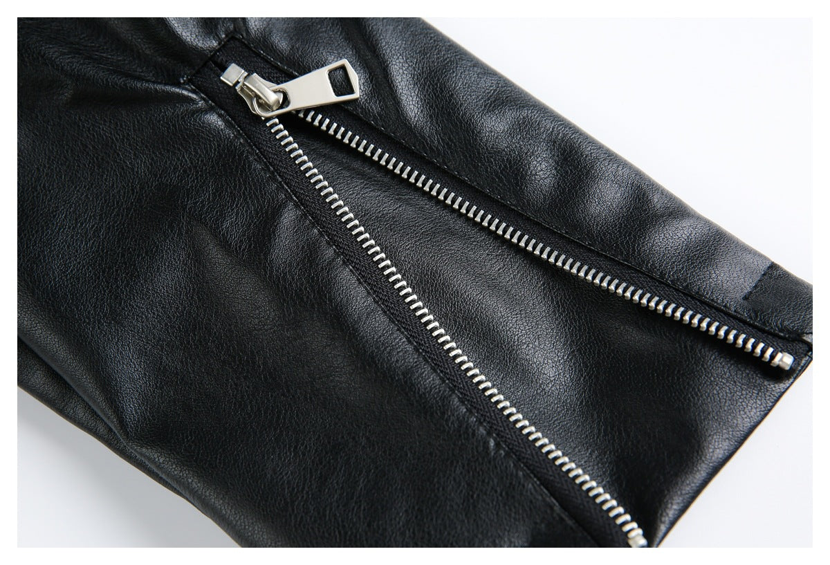 Close-up of a black jacket with silver zipper hardware and a partially opened zipper.