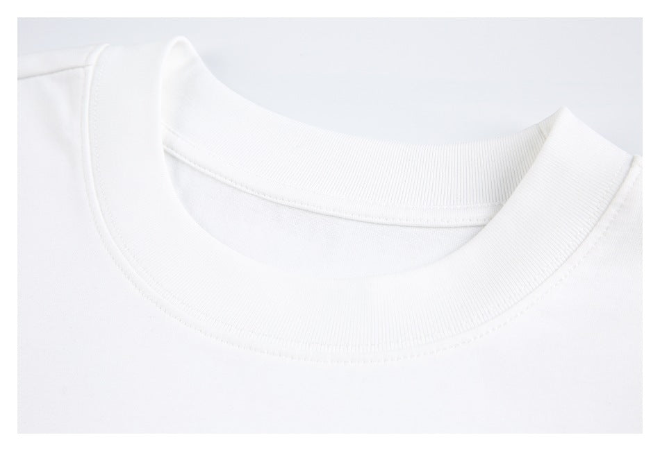 Close-up of a plain white crewneck collar with ribbed trim and stitching.