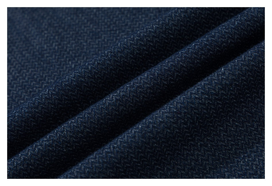 Macro view of the dark navy shirt's repeating woven-looking pattern across folded fabric.