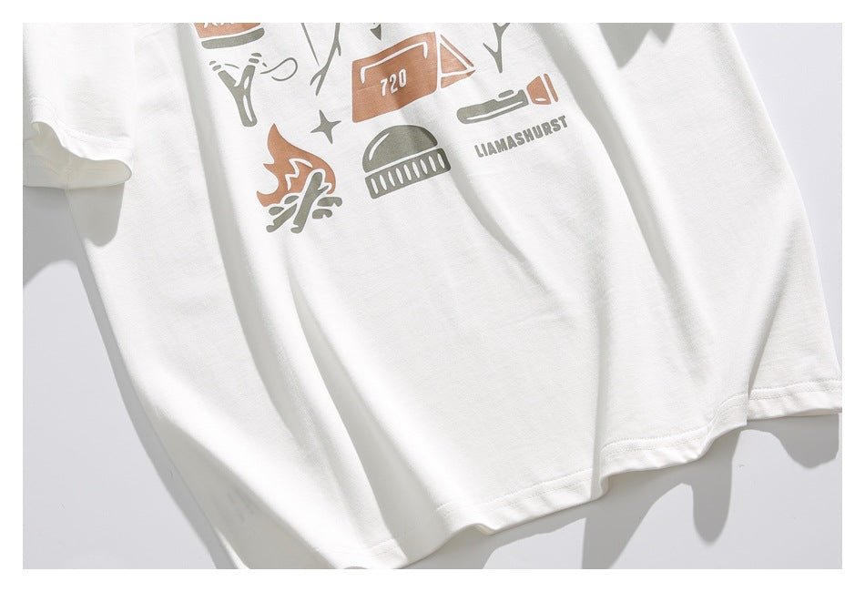 Lower portion of a white T-shirt showing part of its outdoor graphic and the hem.