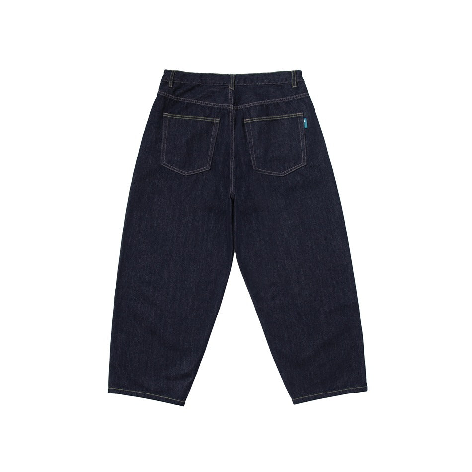 Back view of dark indigo wide-leg jeans with two patch pockets and a small teal tab