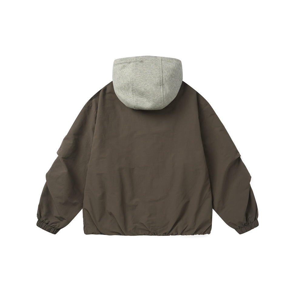 Back view of a brown jacket with gray jersey hood, elastic cuffs and gathered hem, flat lay