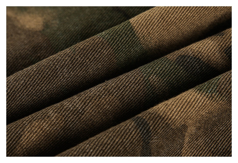 Macro view of the ribbed texture and brown, olive, and black camouflage pattern.
