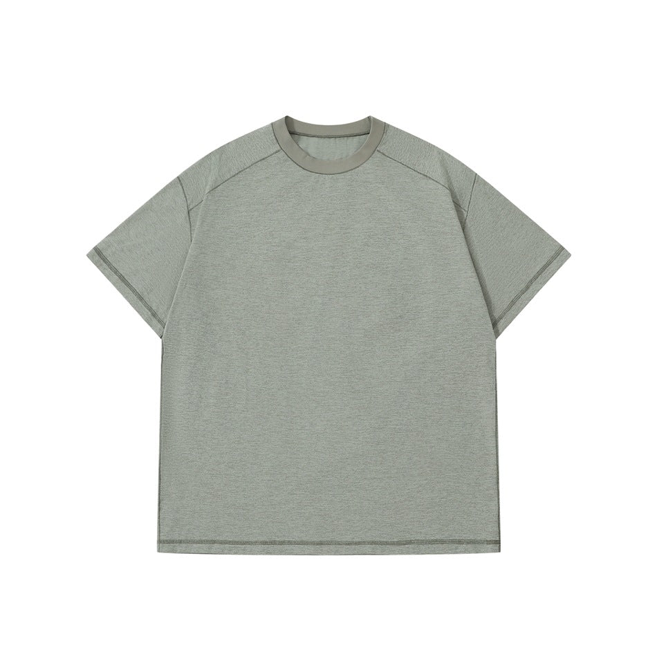 Pea green short-sleeve crew-neck T-shirt flat lay with matching collar band and seams