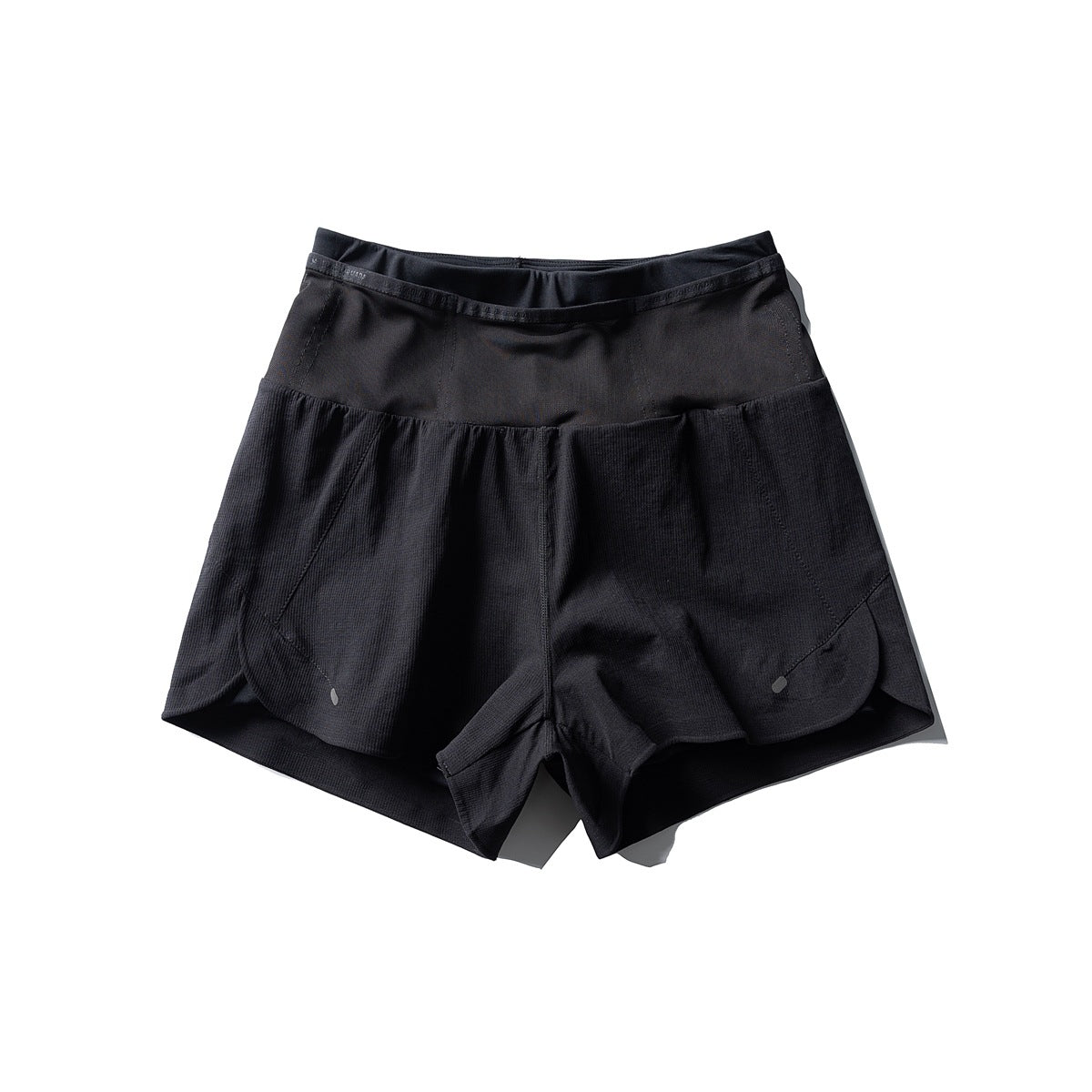 Black double-layer athletic shorts, flat lay front view with wide waist panel and scalloped side hems