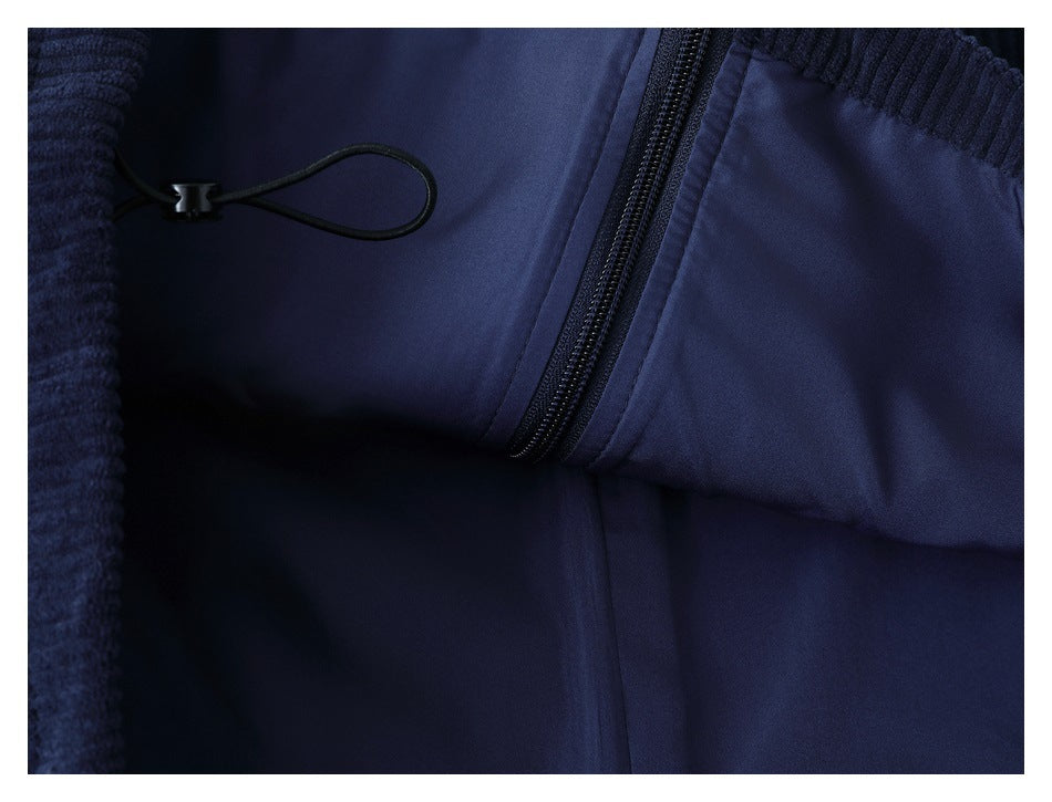 Close-up of the garment interior showing a zipper and black drawcord against navy fabric.