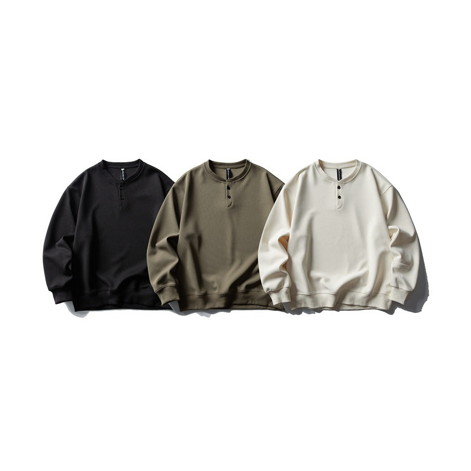 Three long-sleeve button-placket sweatshirts shown in black, olive, and ivory.