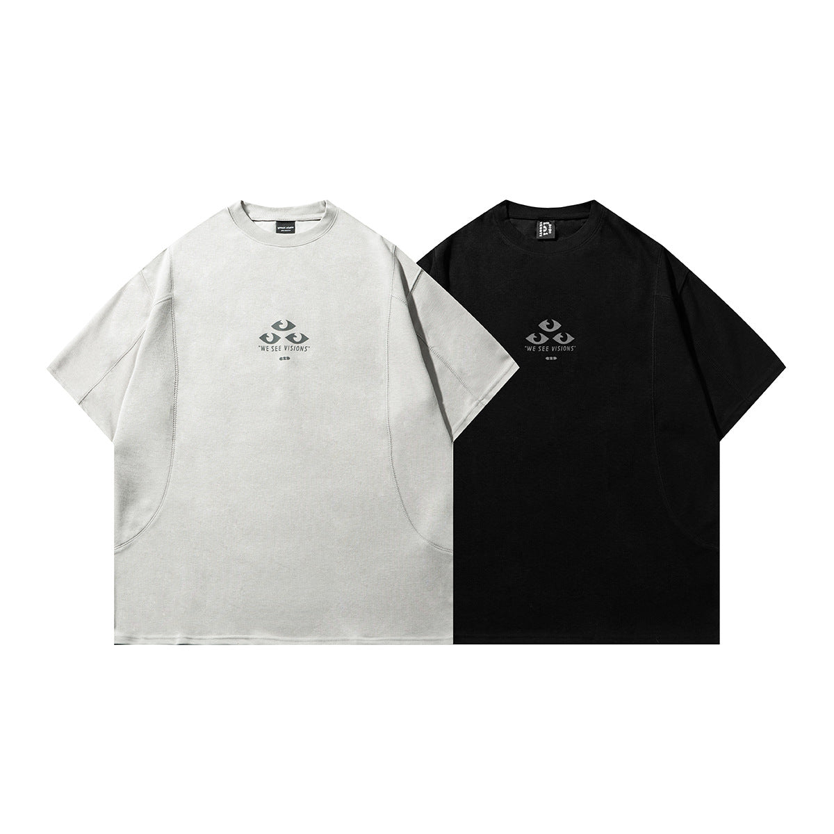 Light gray and black short-sleeve crew-neck T-shirts shown side by side, each with a small eye graphic and “WE SEE VISIONS”