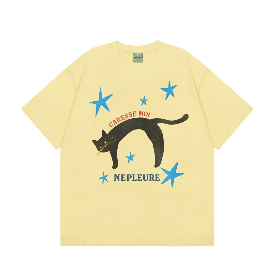 Pale yellow short-sleeve T-shirt with black cat, blue stars and CARESSE MOI NEPLEURE print, flat front view