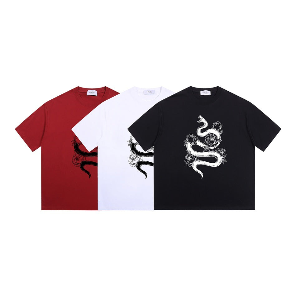 Red, white, and black crew-neck T-shirts shown from the front, each with a snake and flower graphic.
