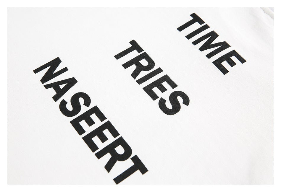 Close-up of white fabric printed with large black TIME, TRIES, and NASERT lettering.