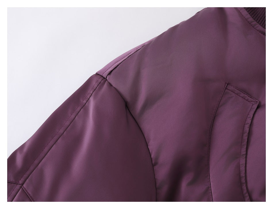 Close-up of the jacket's shoulder seam, sleeve, and curved front pocket.