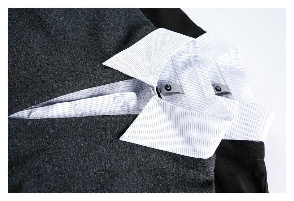 Close-up of the white striped collar and button placket against the dark pullover.