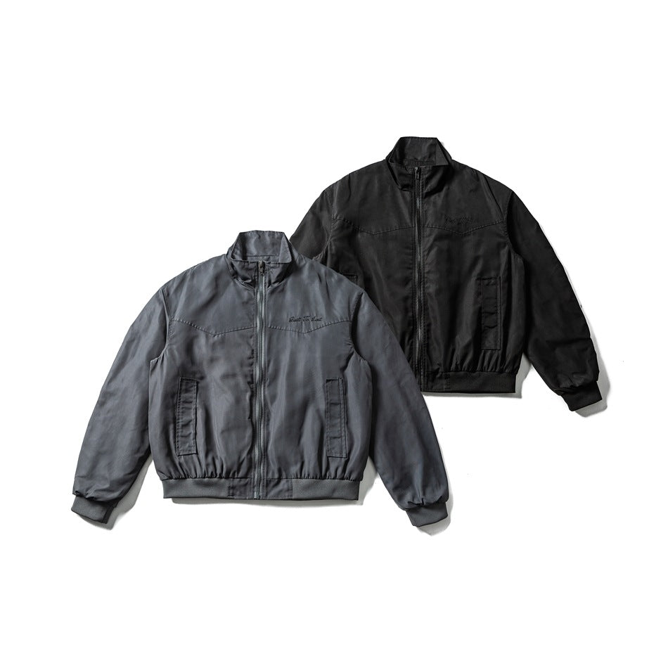 Front views of gray and black zip-up jackets with stand collars, pockets, and ribbed cuffs and hems.