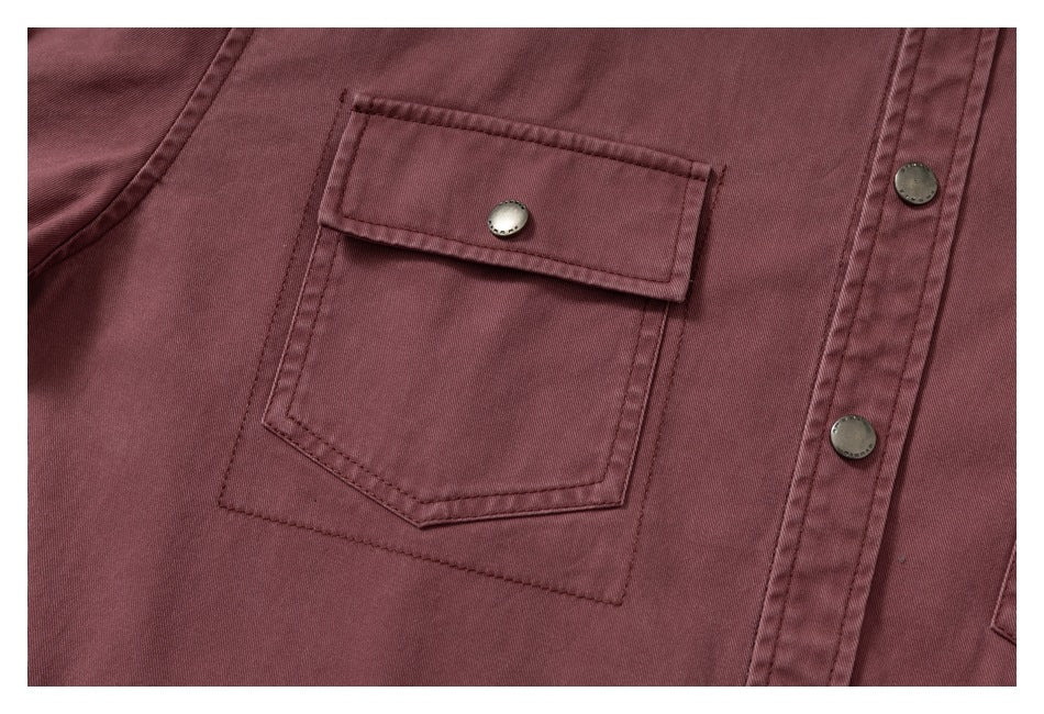 Close-up of the overshirt's flap chest pocket, snap closure, stitching, and front placket.