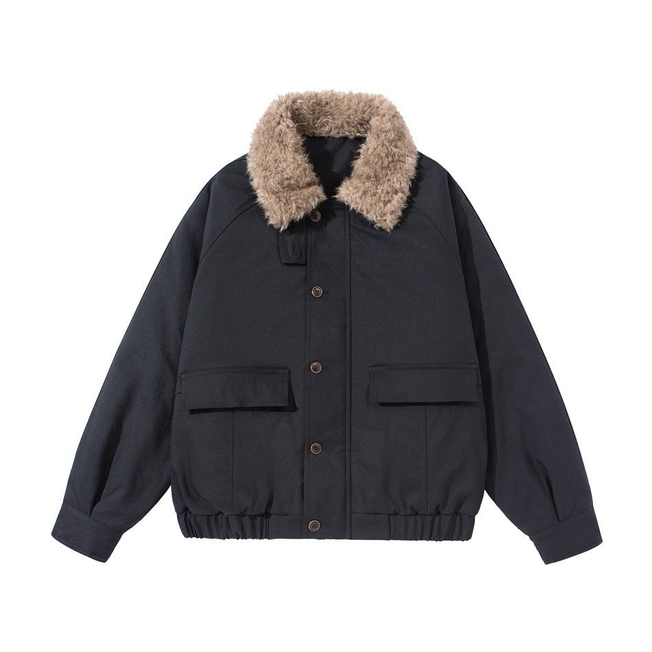 Black bomber-style jacket with tan fluffy textured collar, flap pockets, button front and elastic hem, flat lay