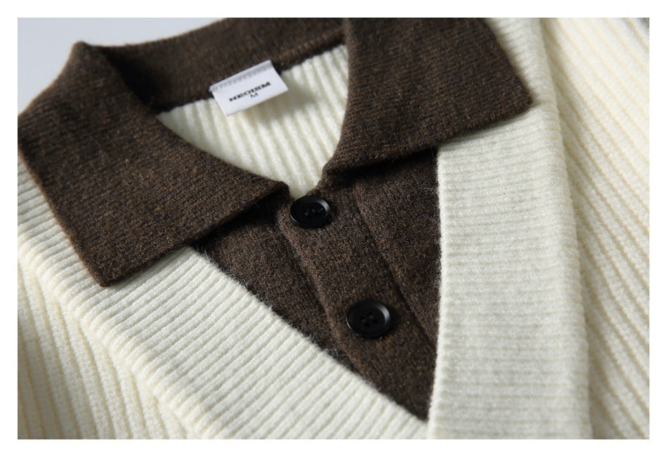 Close-up of the brown collar and two black buttons on an ivory ribbed cardigan.