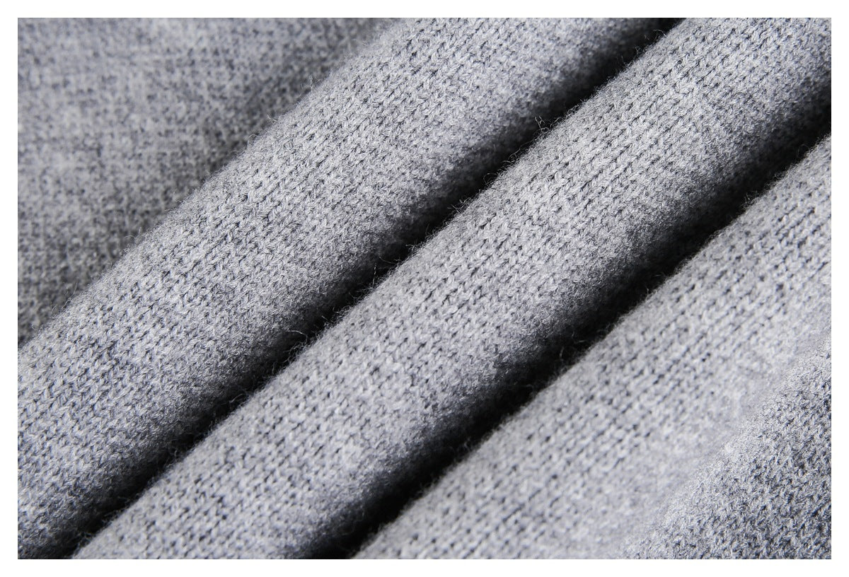 Macro view of the heather gray knit texture arranged in soft folds.