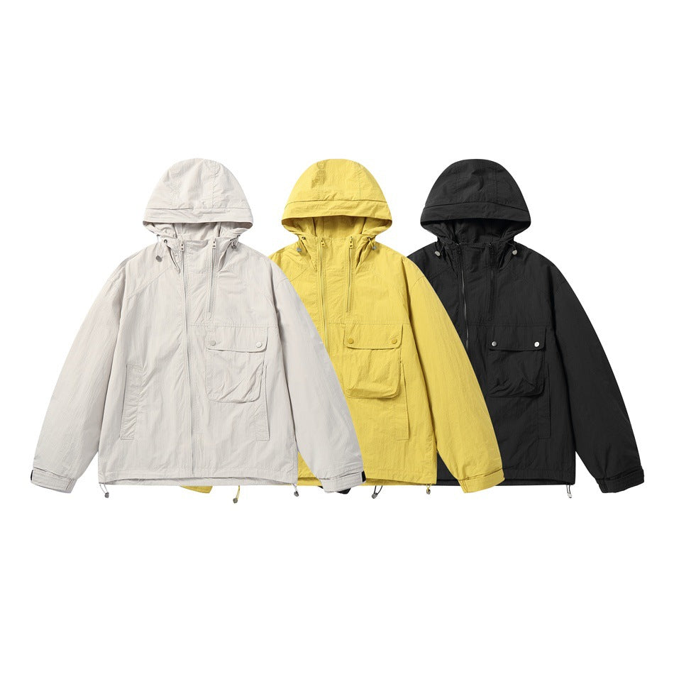 Three hooded jackets shown from the front in light gray, yellow, and black.