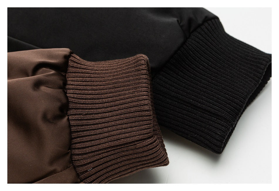 Close-up of the brown ribbed jacket cuff beside a black rib-knit cuff.