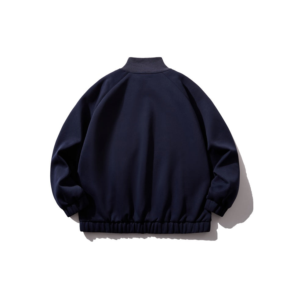 Navy jacket flat lay, back view with ribbed stand collar, raglan sleeves and elastic hem and cuffs