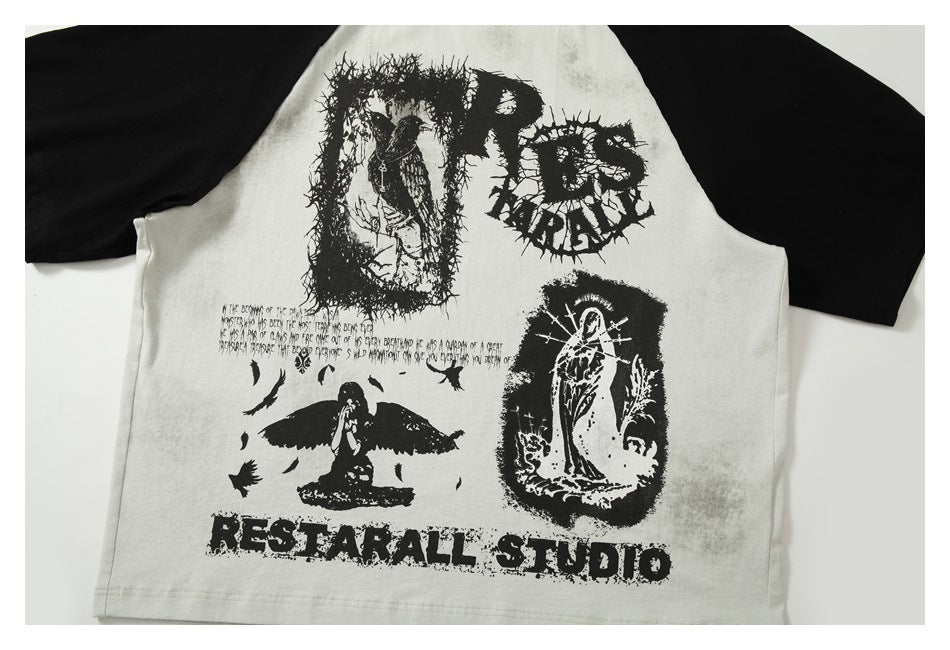 Flat-lay front of an off-white raglan T-shirt with black sleeves and distressed black illustrated graphics and lettering.