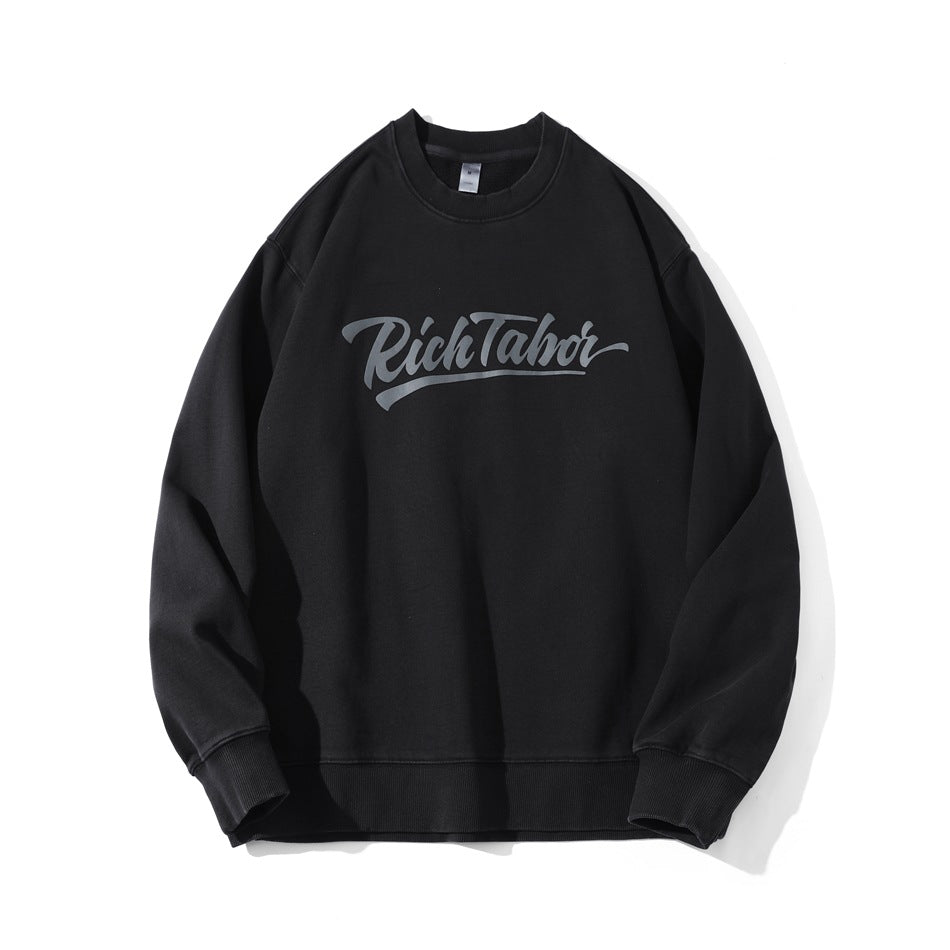 Black washed crew-neck sweatshirt with gray script chest print and ribbed cuffs, flat lay front view
