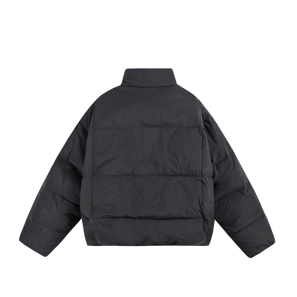 Back view of a black puffer jacket with a high collar and horizontal quilted panels.