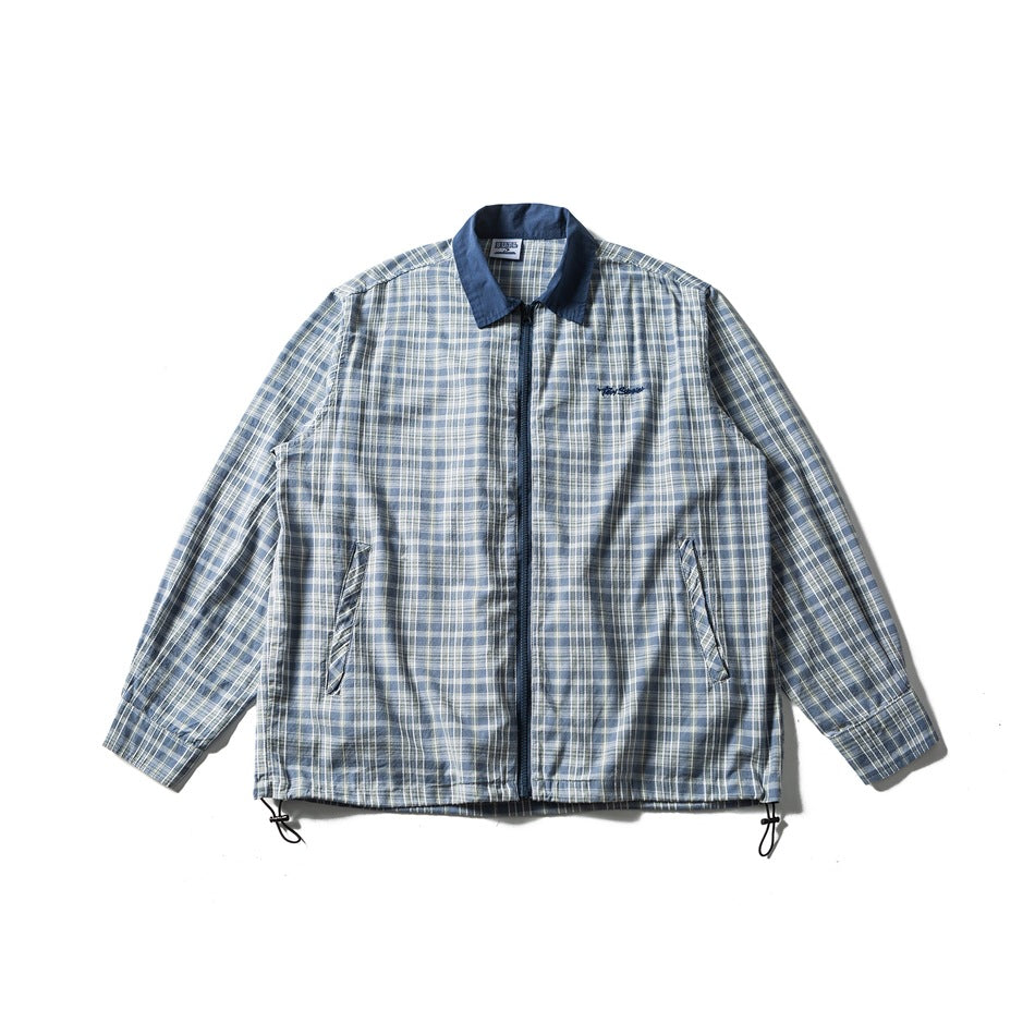Blue plaid zip-front shirt jacket with contrast blue collar, slanted pockets and drawcord hem, flat lay front view